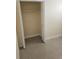 Interior shot of closet space with white shelving for organized storage solutions at 3718 E Henry Ave, Tampa, FL 33610