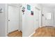 Light and spacious hallway with two closets and wood flooring at 4234 Chesterfield Cir, Palm Harbor, FL 34683