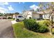 Neatly landscaped exterior of villa with driveway at 4234 Chesterfield Cir, Palm Harbor, FL 34683