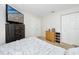 Bright bedroom with a queen-size bed, dresser, and ample closet space at 4234 Chesterfield Cir, Palm Harbor, FL 34683