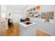 Kitchen area with breakfast bar and built-in shelving at 4234 Chesterfield Cir, Palm Harbor, FL 34683