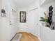 Bright and airy entryway with wood flooring and neutral color palette at 4234 Chesterfield Cir, Palm Harbor, FL 34683