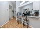 Kitchen features a breakfast bar with two stools at 4234 Chesterfield Cir, Palm Harbor, FL 34683