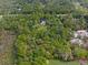 Extensive wooded home site showing aerial view of the home and surrounding natural area at 5143 Culbreath Rd, Brooksville, FL 34601