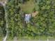 Breathtaking bird's-eye view of home surrounded by dense trees with a serene wooded lot at 5143 Culbreath Rd, Brooksville, FL 34601