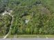 Stunning aerial view of a secluded home nestled within a lush green forest offering privacy at 5143 Culbreath Rd, Brooksville, FL 34601