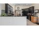 Beautiful black kitchen with black appliances and granite counters at 5143 Culbreath Rd, Brooksville, FL 34601