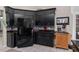 The kitchen features stainless steel appliances and black cabinets at 5143 Culbreath Rd, Brooksville, FL 34601