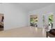Spacious living room with sliding glass doors and natural light at 5143 Culbreath Rd, Brooksville, FL 34601