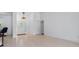 Bright living area with neutral walls, light wood flooring, and natural lighting at 5143 Culbreath Rd, Brooksville, FL 34601