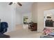 Living room boasts wood floors, piano, and seamless flow into the kitchen at 5143 Culbreath Rd, Brooksville, FL 34601