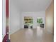 Bright living room with wood floors and access to outdoor patio at 5143 Culbreath Rd, Brooksville, FL 34601