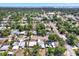 Aerial view of a neighborhood with tree-lined streets, showcasing the community layout and surrounding greenery at 5721 12Th S Ave, Gulfport, FL 33707