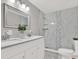 Modern bathroom with double vanity, marble walk-in shower and contemporary fixtures at 5721 12Th S Ave, Gulfport, FL 33707