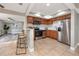 This spacious kitchen features tile floors, stainless appliances, and wood cabinetry at 5721 12Th S Ave, Gulfport, FL 33707