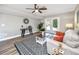 Cozy living room featuring modern decor, a patterned rug, and doors leading to the outdoor space at 5721 12Th S Ave, Gulfport, FL 33707