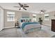 The main bedroom is spacious and well-lit, with a ceiling fan and wood floors at 5721 12Th S Ave, Gulfport, FL 33707
