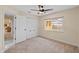 Bedroom with closet, ceiling fan, and window overlooking the backyard at 9605 Woodbay Dr, Tampa, FL 33626