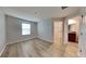 Bright bedroom featuring wood-look floors and an ensuite bathroom at 3934 Cat Mint St, Tampa, FL 33619