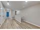 Upstairs hallway with wood-look floors leading to bedrooms at 3934 Cat Mint St, Tampa, FL 33619