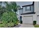 Two-story townhome with attached garage and landscaping at 3934 Cat Mint St, Tampa, FL 33619