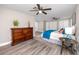 Primary bedroom with king-size bed, dresser, and double door closet at 5721 12Th S Ave, Gulfport, FL 33707