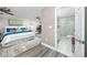 Main bedroom with en-suite bathroom and grey flooring at 5721 12Th S Ave, Gulfport, FL 33707