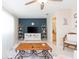 Living room with a white couch, coffee table and a ceiling fan at 907 La Jolla Ave, Sun City Center, FL 33573
