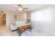 Living room featuring a white couch and large window with sheer curtains at 907 La Jolla Ave, Sun City Center, FL 33573