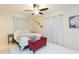 Spacious bedroom with a queen bed and seating at 907 La Jolla Ave, Sun City Center, FL 33573