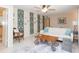 Living room with white couch and patterned wallpaper accent at 907 La Jolla Ave, Sun City Center, FL 33573