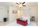 Large bedroom with queen bed and ample natural light at 907 La Jolla Ave, Sun City Center, FL 33573