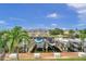 Boats docked at the waterfront with a view of nearby houses at 4789 Coquina Key Se Dr, St Petersburg, FL 33705