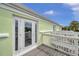 Private balcony with glass door and white railing, offering an outdoor space at 4789 Coquina Key Se Dr, St Petersburg, FL 33705