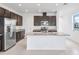 Bright open kitchen with granite countertops, stainless steel appliances, and a central island at 15876 Mulrion Blvd, Punta Gorda, FL 33982