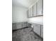 Bright home office featuring gray cabinets, drawers and countertop workspace, ideal for remote work or creative projects at 15876 Mulrion Blvd, Punta Gorda, FL 33982
