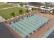 Well-maintained shuffleboard courts with benches at 2013 E Del Webb Blvd, Sun City Center, FL 33573