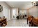 Open concept dining area with a large table and access to the entryway at 2117 Valterra Vista Way, Valrico, FL 33594