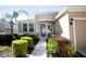 Well maintained front yard with walkway and landscaping at 2117 Valterra Vista Way, Valrico, FL 33594