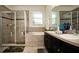 Clean bathroom with double sinks, tub, and shower at 2117 Valterra Vista Way, Valrico, FL 33594