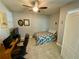 Bright bedroom with a comfortable bed, desk and tiled floors at 2117 Valterra Vista Way, Valrico, FL 33594