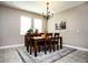 Spacious dining room with a large table, chandelier, and ample natural light at 2117 Valterra Vista Way, Valrico, FL 33594