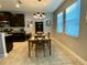 Spacious dining area with dark cabinets and tile floors at 2117 Valterra Vista Way, Valrico, FL 33594