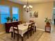 Formal dining room with chandelier and large windows at 2117 Valterra Vista Way, Valrico, FL 33594