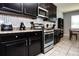Bright kitchen with dark cabinets and granite countertops at 2117 Valterra Vista Way, Valrico, FL 33594