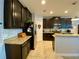 Modern kitchen with granite countertops and stainless steel appliances at 2117 Valterra Vista Way, Valrico, FL 33594