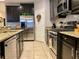 Kitchen features stainless steel appliances and granite countertops at 2117 Valterra Vista Way, Valrico, FL 33594