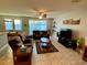 Relaxing living room with tile floors and a ceiling fan at 2117 Valterra Vista Way, Valrico, FL 33594