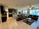 Spacious living room with tile floors and comfortable seating at 2117 Valterra Vista Way, Valrico, FL 33594