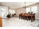 Formal dining room featuring a large wooden table and chandelier at 2117 Valterra Vista Way, Valrico, FL 33594